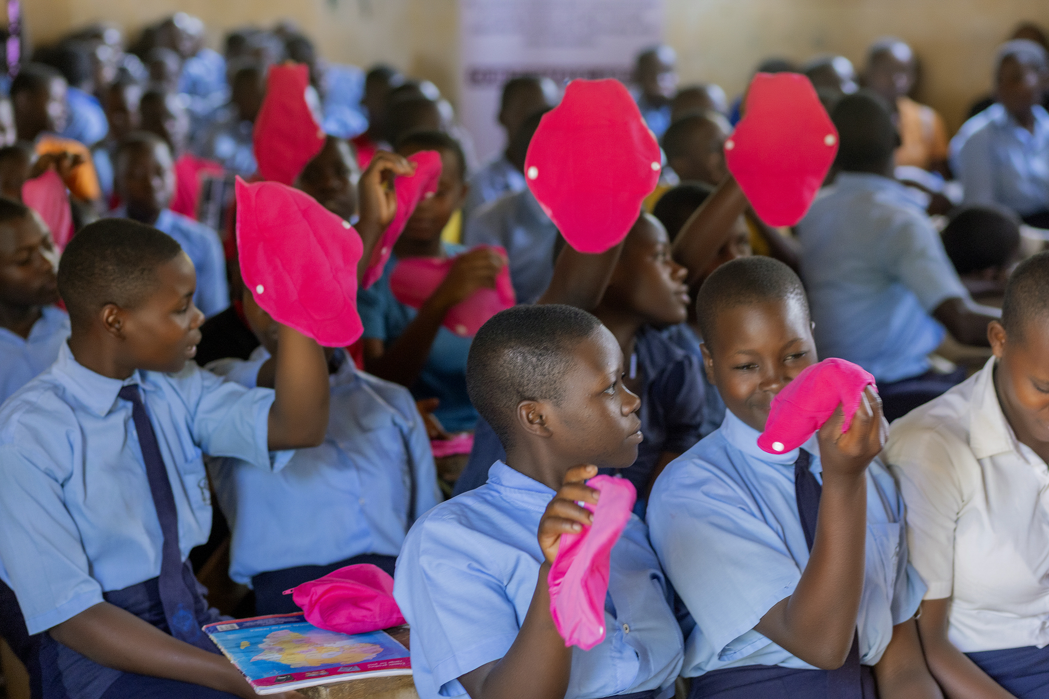 Girls holding reusable sanitary pads from Msichana
